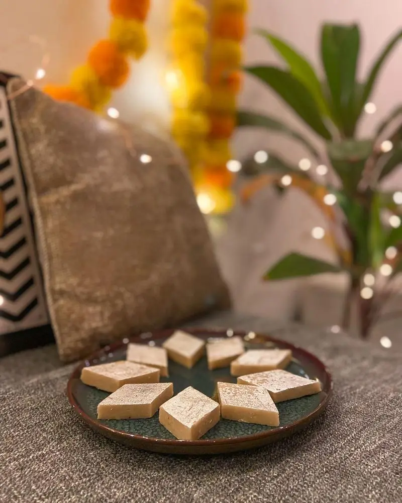A plate of Indian sweets set out with festive decoration