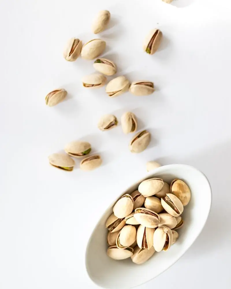 Pistachios in their shells, in a dish